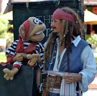 Capt'n Jack Spareribs holding Maynard the Talking Monkey, close up.